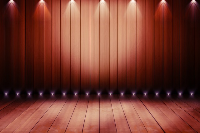 Bare stage with spotlights and stage curtains